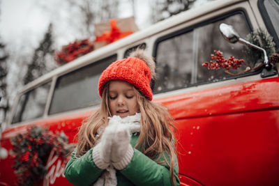 Portrait of young woman in car