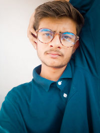 Portrait of young man wearing eyeglasses