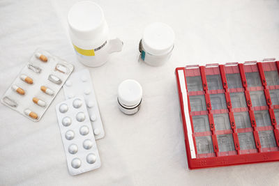 Various pills and medications at table