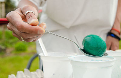 Close-up of person working in container