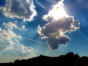 Sun shining through clouds
