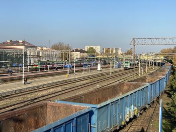 Train at railroad station against clear sky