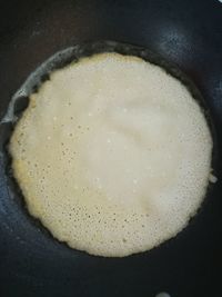 High angle view of egg in frying pan