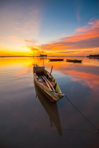 Wonderful light of sunset with fisherman boat