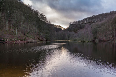 Scenic view of lake against cloudy sky