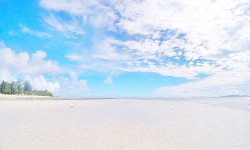 Scenic view of sea against blue sky