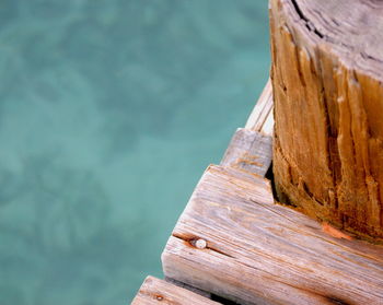 Close-up of wood against sea