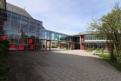 Buildings in city against clear sky