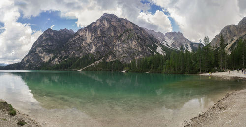 Scenic view of lake and mountains against sky