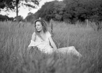 Portrait of woman on field