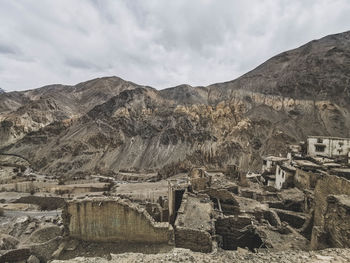 Panoramic shot of building in mountains against sky