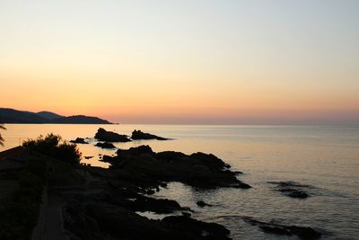 Scenic view of sea against sky during sunset