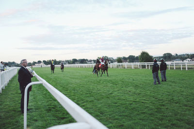 Group of people on grassy field