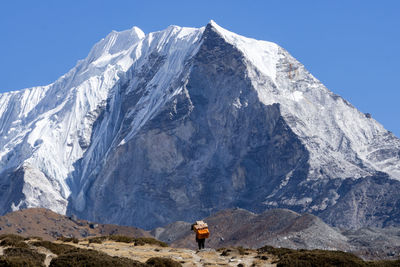 Scenic view of snowcapped mountain against sky, porter, nepal, himalaya, sherpa