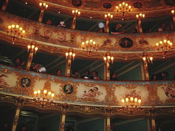 Low angle view of illuminated chandelier