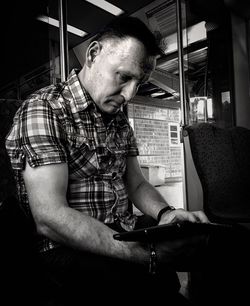 Young man sitting in bus