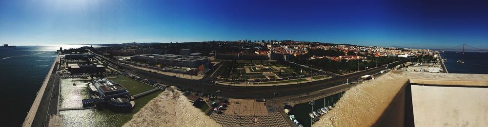 High angle view of road by buildings against sky