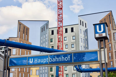 Low angle view of buildings against blue sky