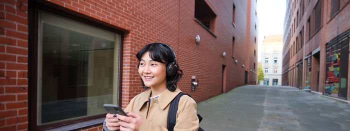 Young woman using mobile phone