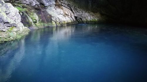 Scenic view of waterfall against sky