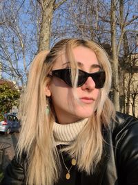 Portrait of young woman wearing sunglasses