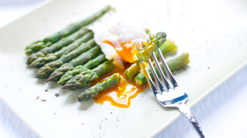 High angle view of vegetables in plate on table