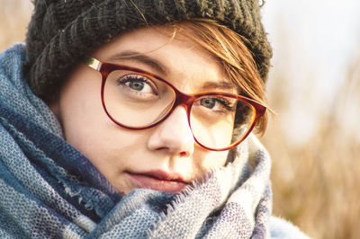 Close-up portrait of woman wearing hat