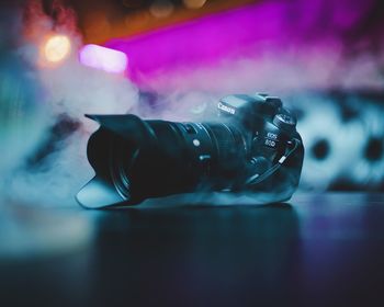 Close-up of illuminated lighting equipment on table