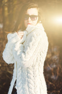 Portrait of woman standing in snow