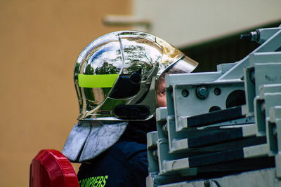 Close-up of man working on metal