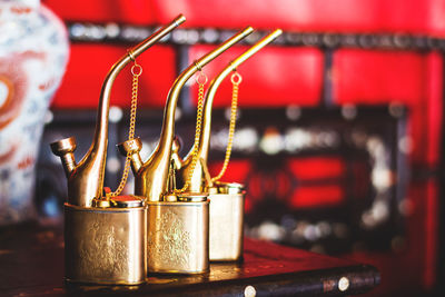 Close-up of old-fashioned hookahs on table