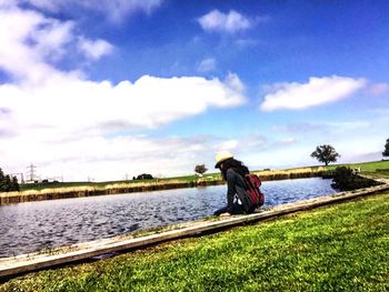 View of lake against cloudy sky