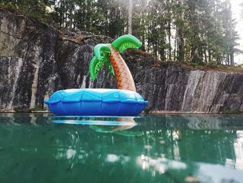 Blue toy floating on lake