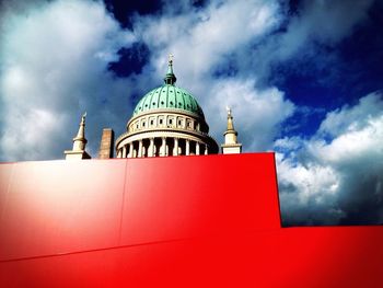 Low angle view of church against cloudy sky