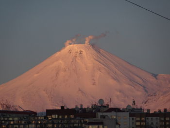 Aerial view of snowcapped mountain against sky