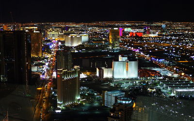 High angle view of illuminated city buildings at night