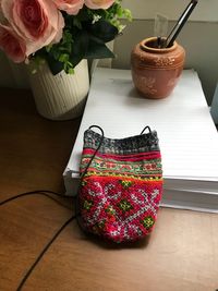 High angle view of roses in pot on table at home