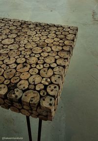High angle view of wood logs against wall