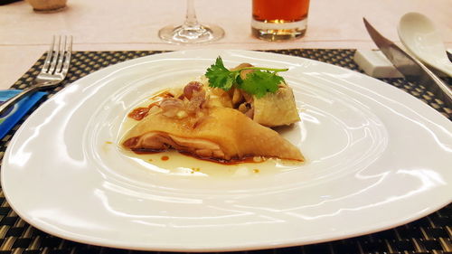 Close-up of served food in plate