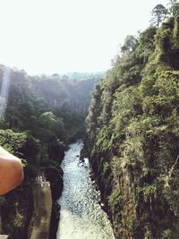 Scenic view of waterfall against clear sky