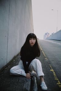 Portrait of smiling woman sitting outdoors