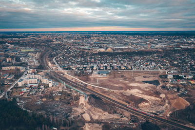 High angle view of illuminated cityscape against sky