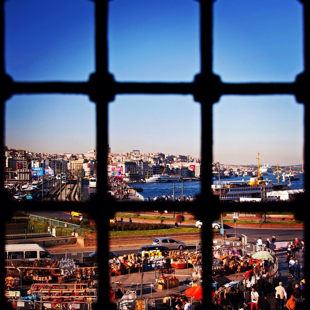 city, large group of people, built structure, architecture, cityscape, building exterior, city life, crowded, sky, illuminated, men, transportation, crowd, travel destinations, metal, amusement park, incidental people, outdoors, person