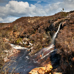 View of landscape against cloudy sky
