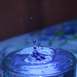 Close-up of water drop on glass