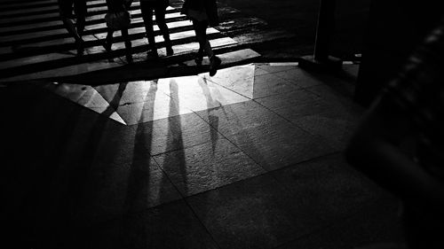 Low section of people on tiled floor