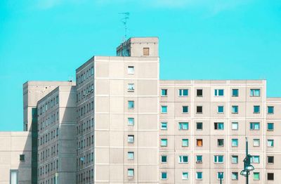 Low angle view of buildings against blue sky