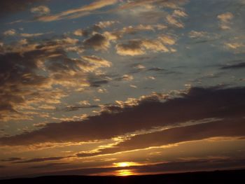 Low angle view of dramatic sky during sunset