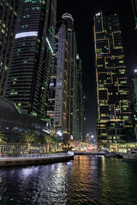 Illuminated buildings in city at night