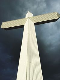 Low angle view of building against cloudy sky